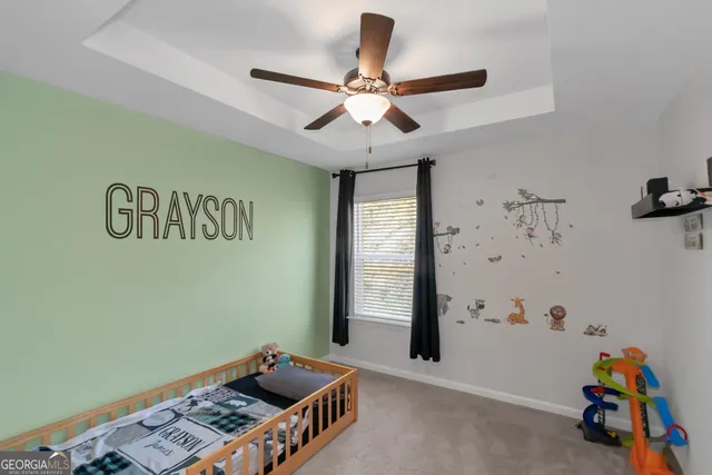 a bathroom with a sink toilet vanity and shower