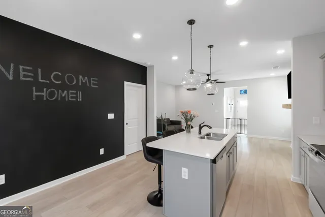 a bathroom with a sink vanity granite tub shower and a mirror