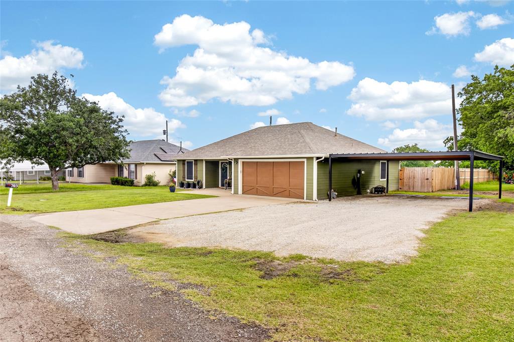 703 College Street Celeste, TX 75423 - Photo 3 of 29 a view of an house with backyard and swimming pool