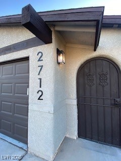 2712 Rialto Road Las Vegas, NV 89108 - Photo 31 of 54 Doorway to property with stucco siding