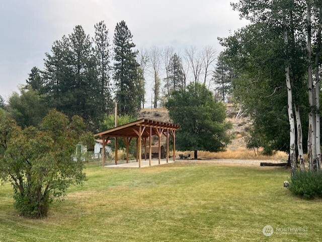 29 Twisp Airport Road Twisp, WA 98856 - Photo 4 of 19 a view of swimming pool with lawn chairs and trees