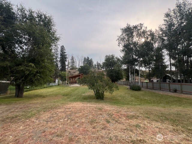 29 Twisp Airport Road Twisp, WA 98856 - Photo 8 of 19 a backyard of a house with lots of green space
