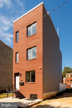 a backyard of a house with swimming pool