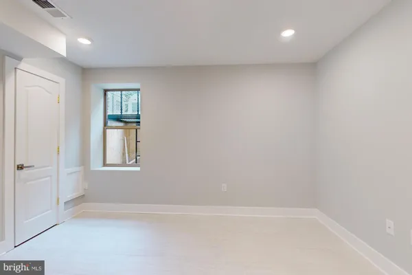 a view of an empty room with a window