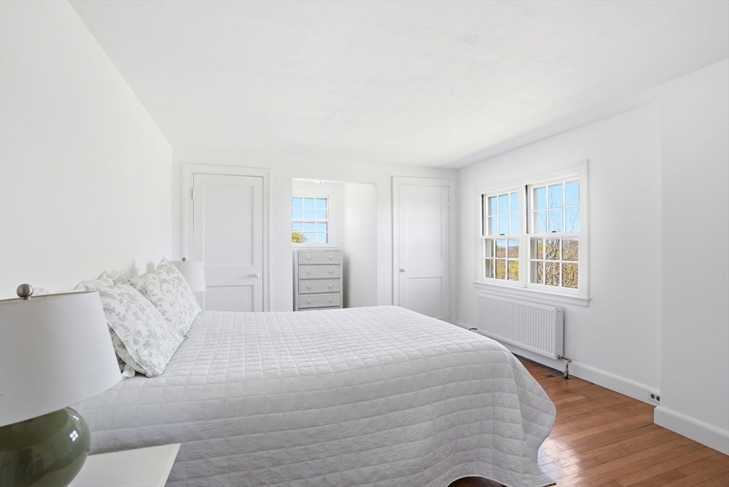 34 Governor Long Road Hingham, MA 02043 - Photo 13 of 37 a bedroom with a bed and a window