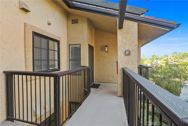 a view of a balcony with wooden floor