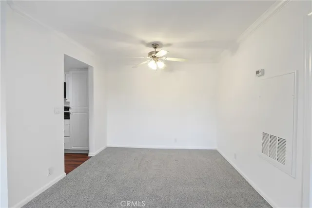 a kitchen with granite countertop a sink and cabinets
