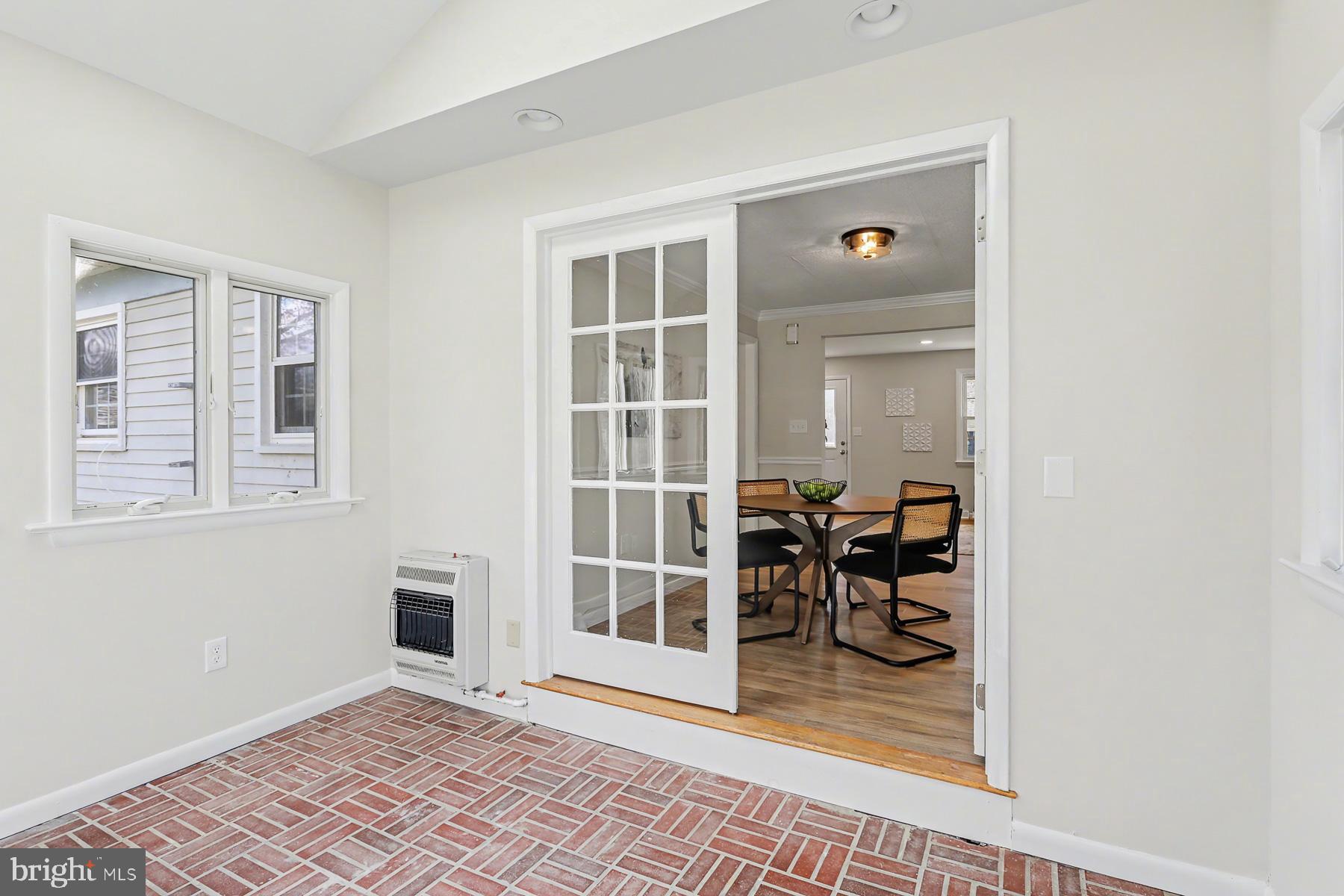 233 Cardinal Road Lititz, PA 17543 - Photo 13 of 26 a view of a hallway with wooden floor and a living room