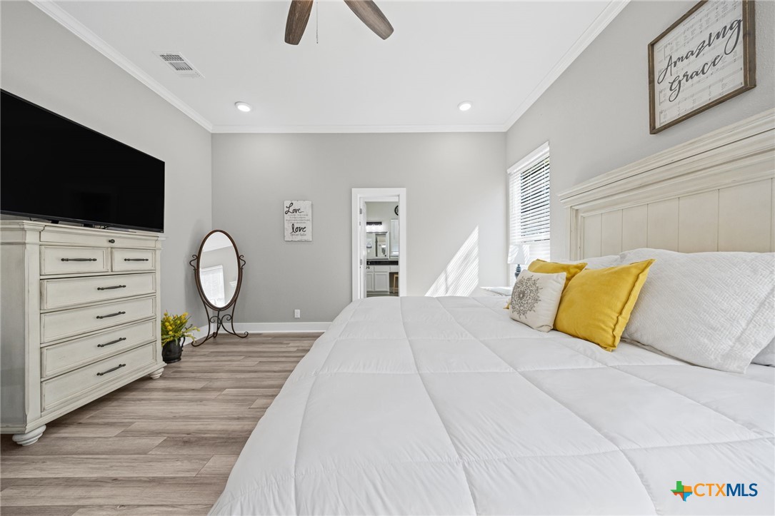 28099 Fm 2670 Killeen, TX 76549 - Photo 11 of 48 a bedroom with a bed and a flat tv screen on dresser