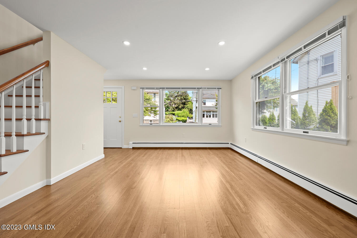 248 Byram Road, Unit L Greenwich, CT 06830 - Photo 3 of 14 wooden floor in an empty room with a window