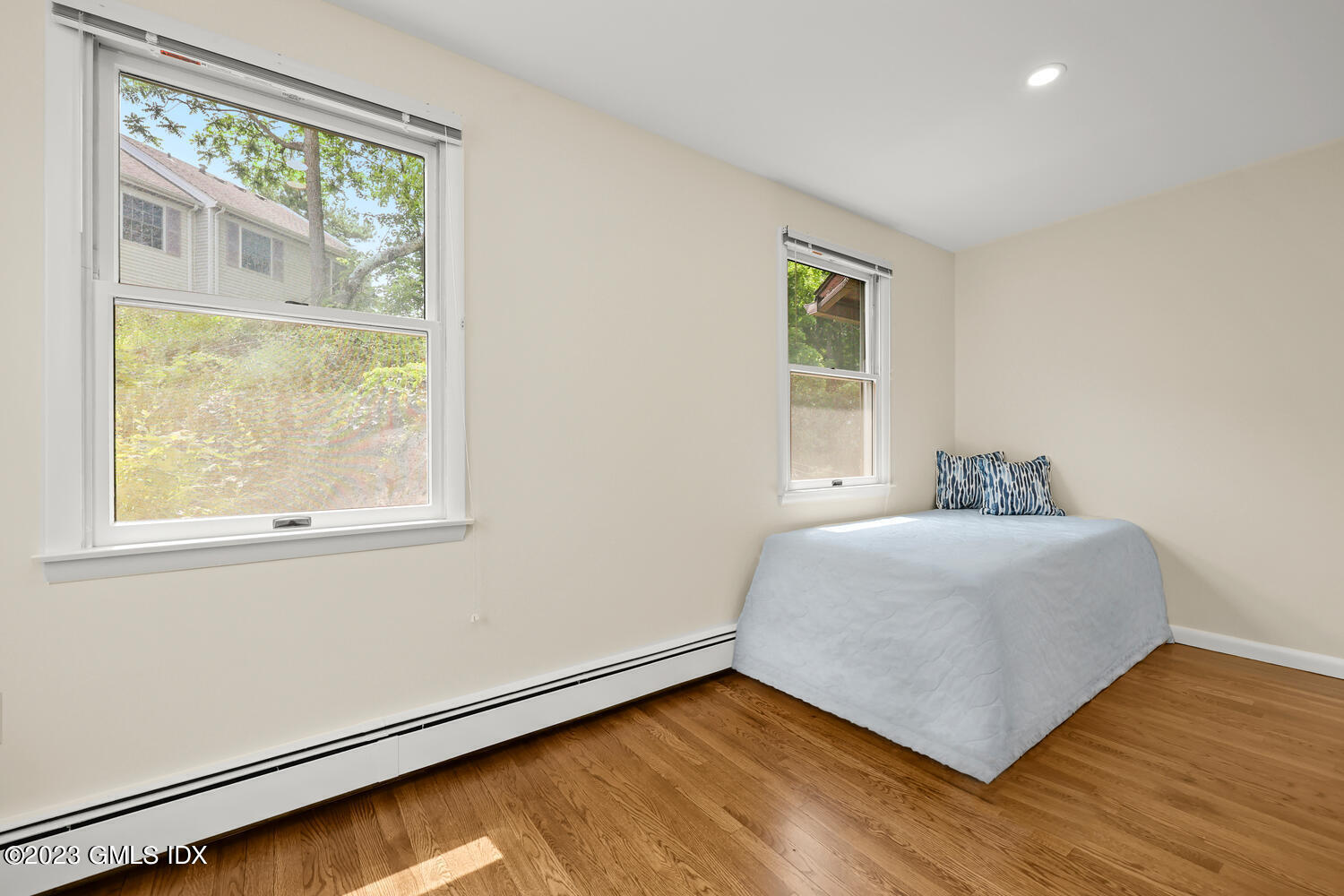 248 Byram Road, Unit L Greenwich, CT 06830 - Photo 9 of 14 a room with a window and a wooden floor