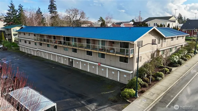 a view of a house with wooden fence and windows