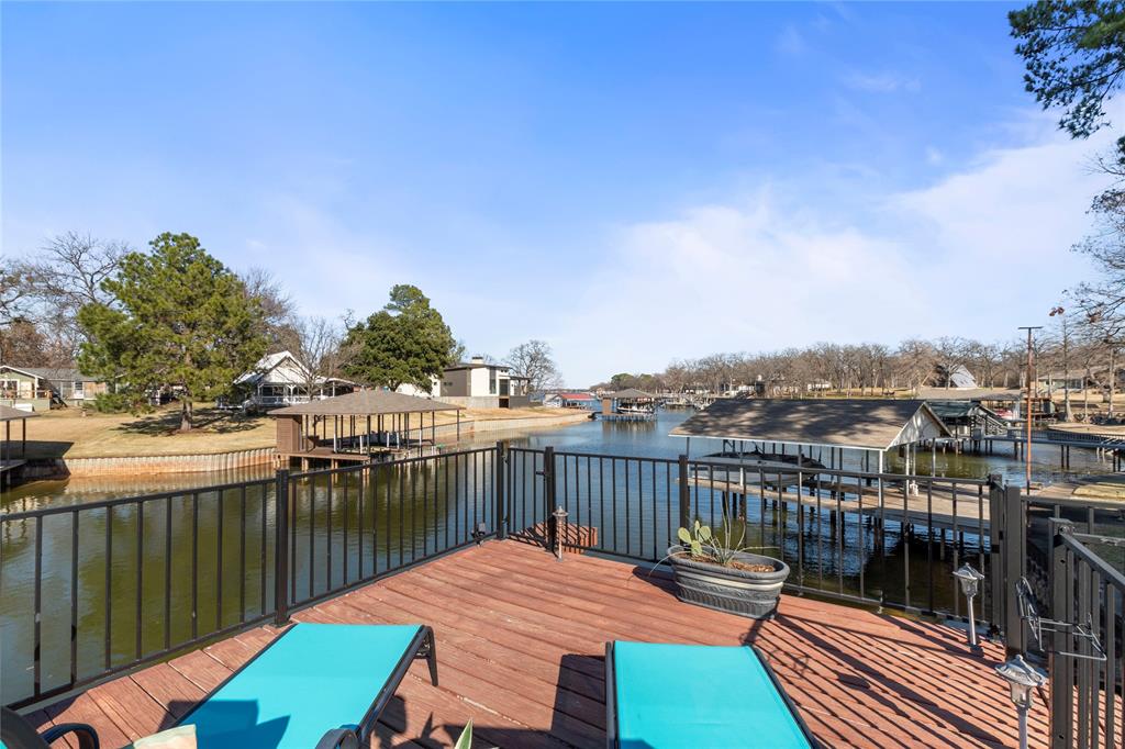 a view of a balcony with two chairs