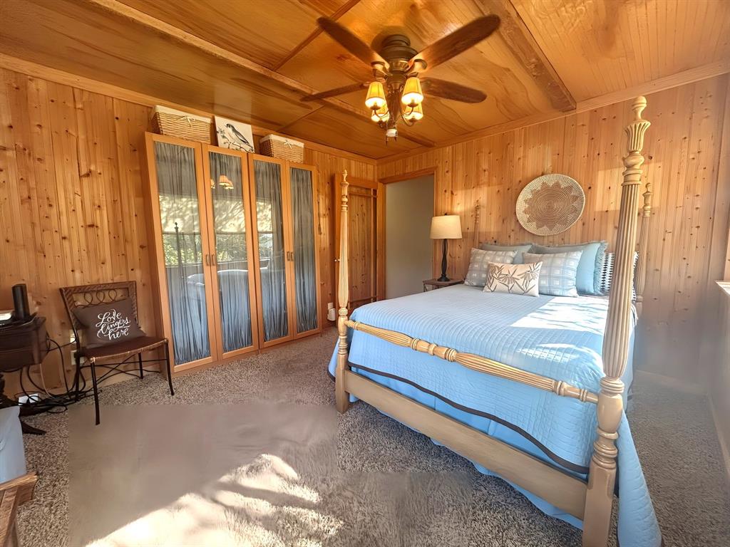 313 Sundown Trail Tool, TX 75143 - Photo 22 of 39 a bedroom with a large bed and a window