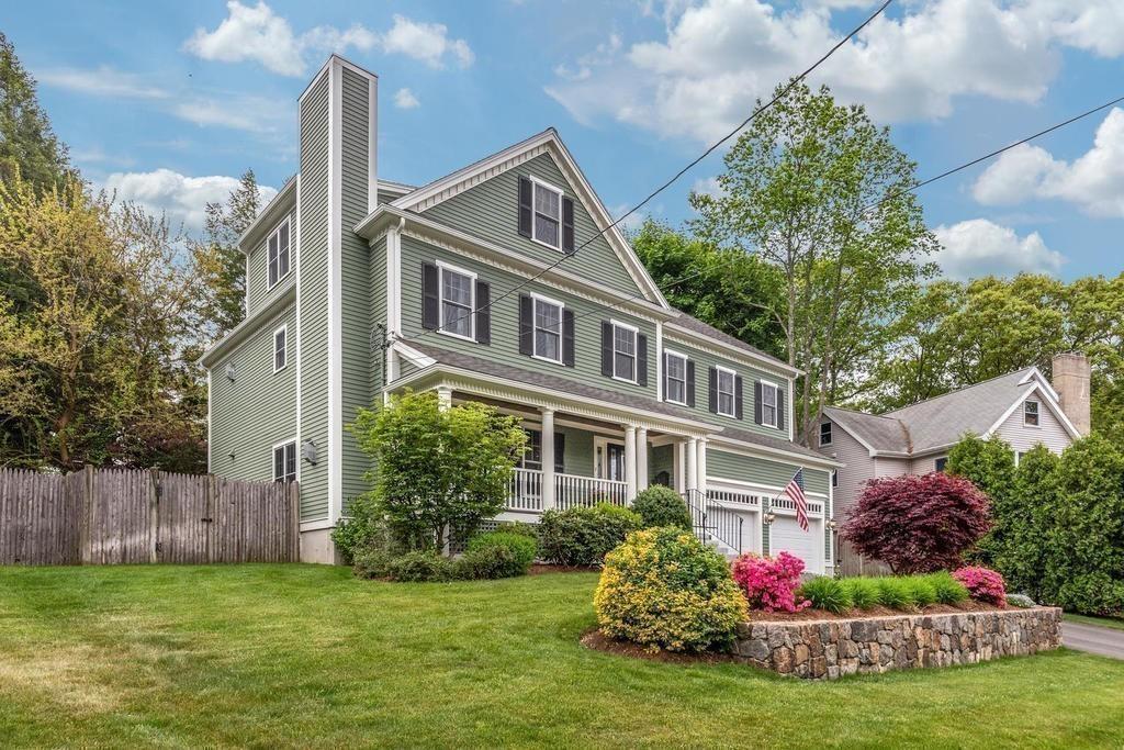 9 Stimson Avenue Lexington, MA 02421 - Photo 25 of 30 a front view of a house with a yard and potted plants