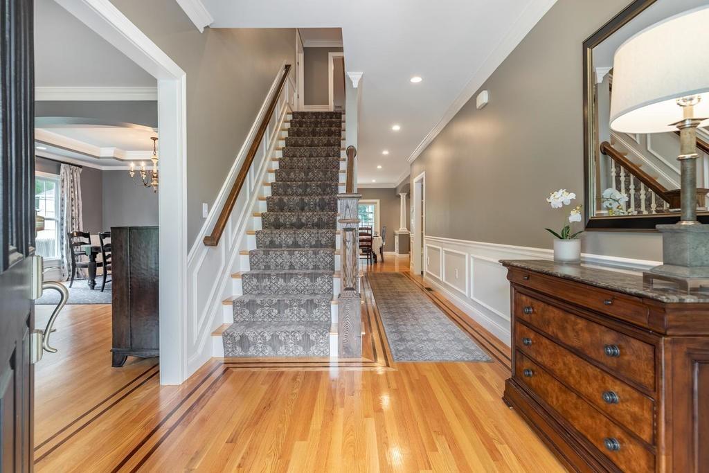 9 Stimson Avenue Lexington, MA 02421 - Photo 3 of 30 a view of a hallway with wooden floor and staircase