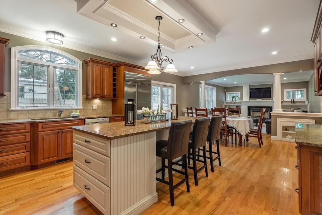 9 Stimson Avenue Lexington, MA 02421 - Photo 5 of 30 a kitchen with lots of counter top space and dining table