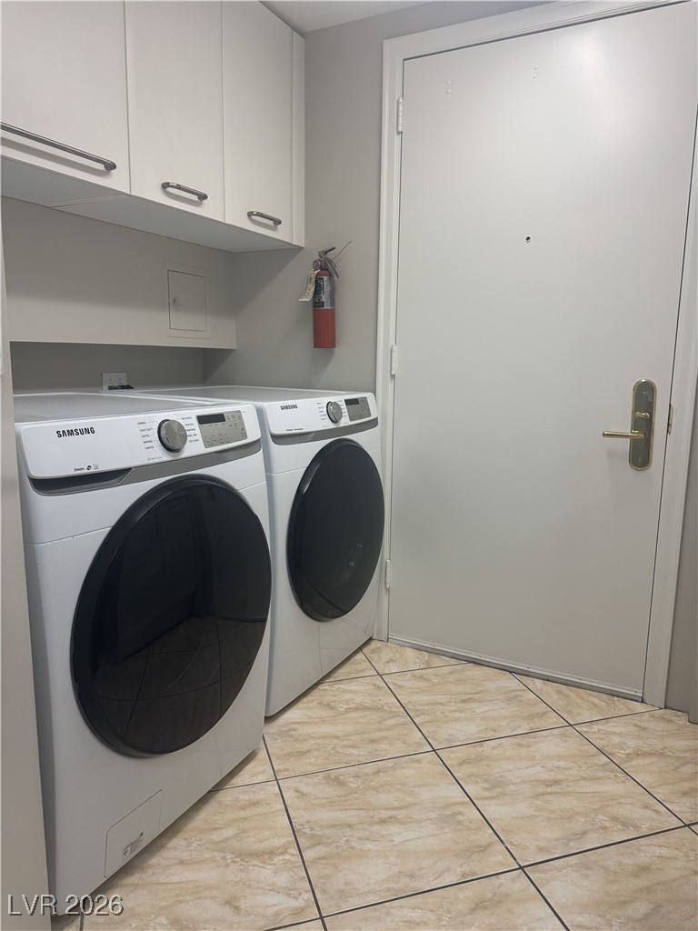 2857 Paradise Road, Unit 904 Las Vegas, NV 89109 - Photo 17 of 27 Laundry area with separate washer and dryer and cabinet space