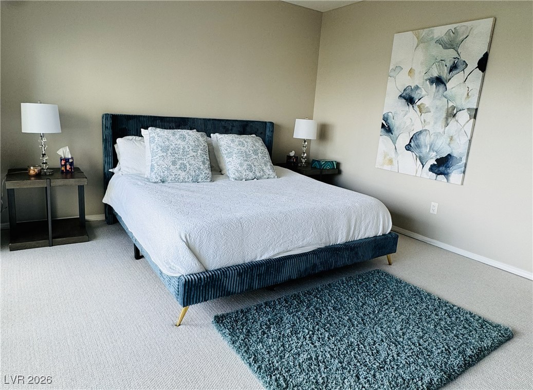 2857 Paradise Road, Unit 904 Las Vegas, NV 89109 - Photo 21 of 27 Carpeted bedroom featuring baseboards