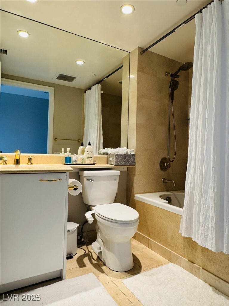 2857 Paradise Road, Unit 904 Las Vegas, NV 89109 - Photo 23 of 27 Bathroom featuring tiled shower / bath combo, recessed lighting, vanity, and light tile patterned flooring