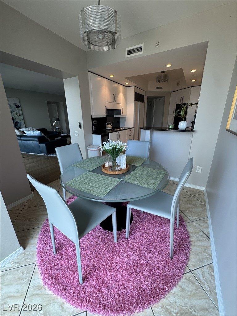 2857 Paradise Road, Unit 904 Las Vegas, NV 89109 - Photo 8 of 27 Dining area featuring recessed lighting and baseboards