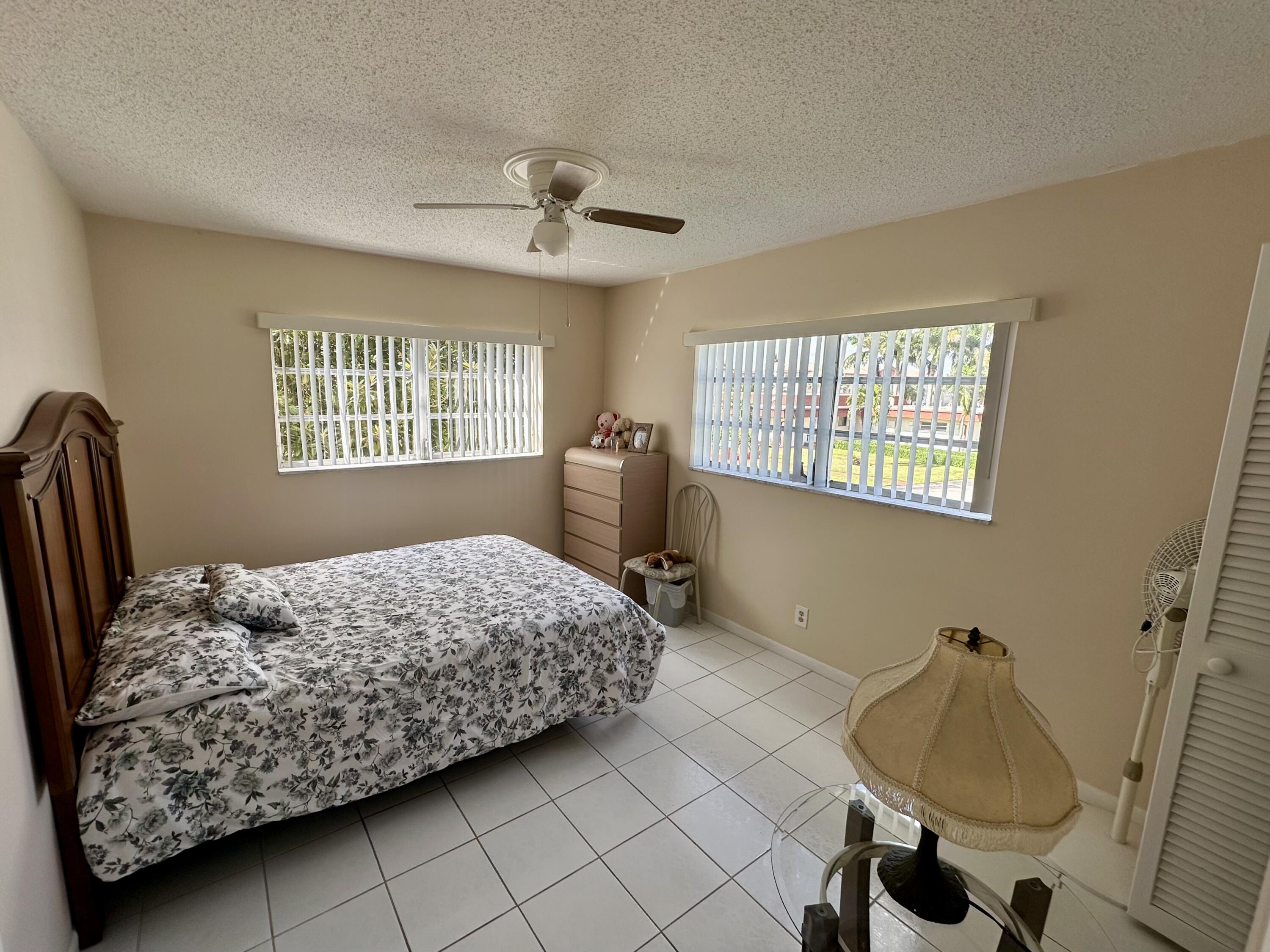 5300 Washington Street, Unit L240 Hollywood, FL 33021 - Photo 7 of 8 a bedroom with a bed and a window