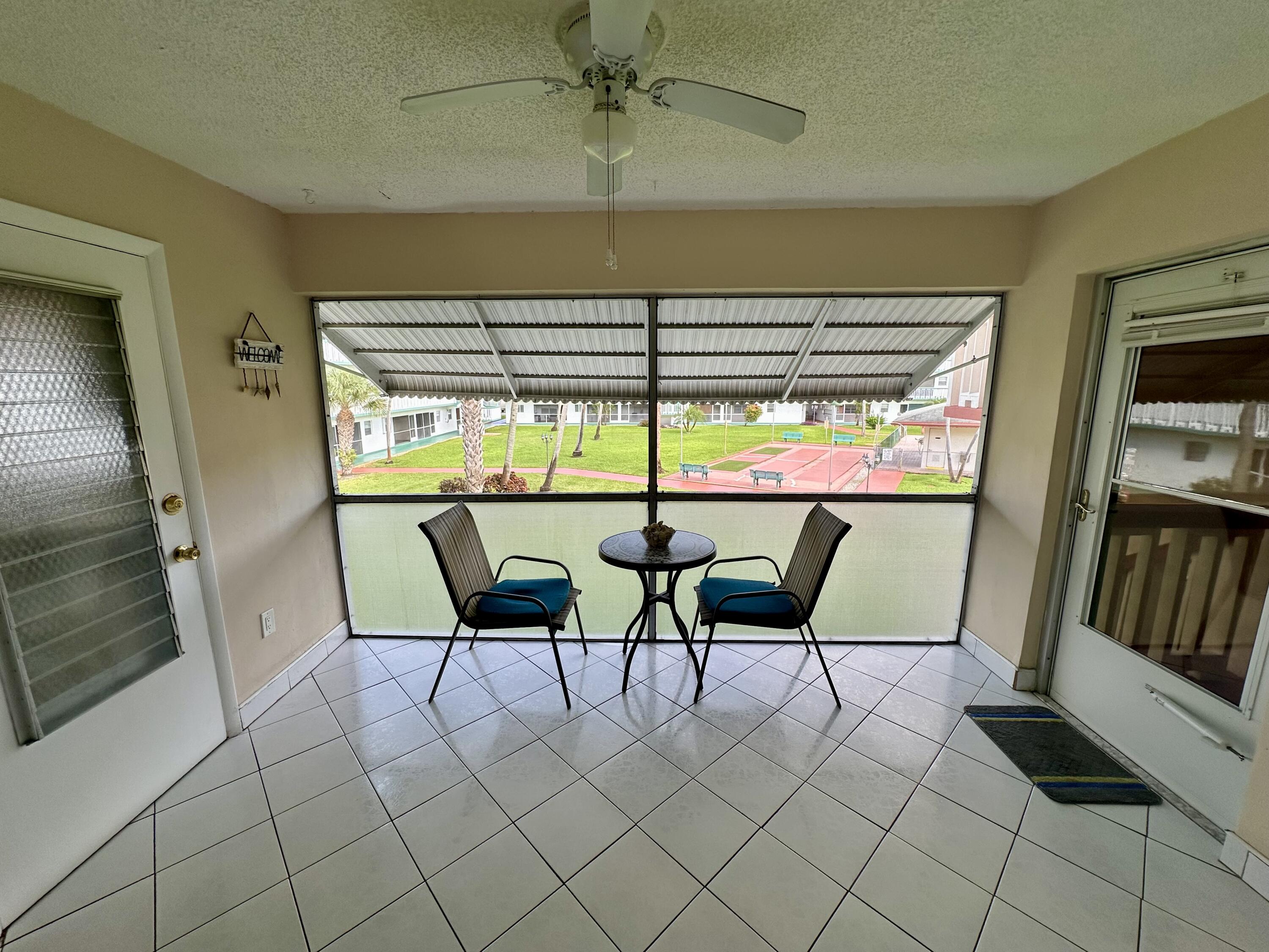 5300 Washington Street, Unit L240 Hollywood, FL 33021 - Photo 8 of 8 a view of a dining room with furniture window and outside view