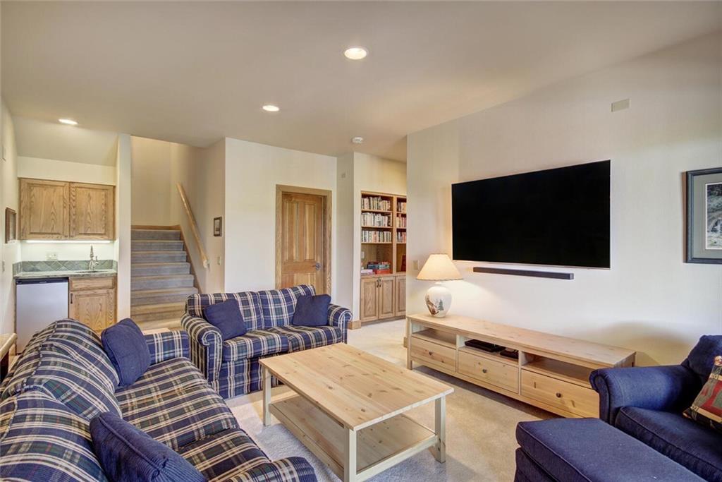265 Mountain Bluebell Road Keystone, CO 80435 - Photo 11 of 35 a living room with furniture and a flat screen tv