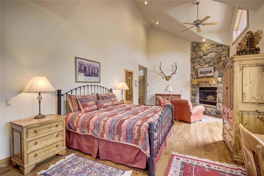 265 Mountain Bluebell Road Keystone, CO 80435 - Photo 14 of 35 a bedroom with bed and a lamp on dresser