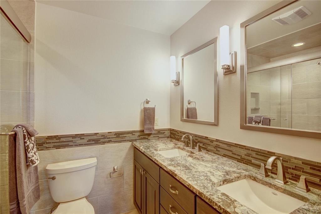 265 Mountain Bluebell Road Keystone, CO 80435 - Photo 16 of 35 a bathroom with a granite countertop toilet sink and mirror