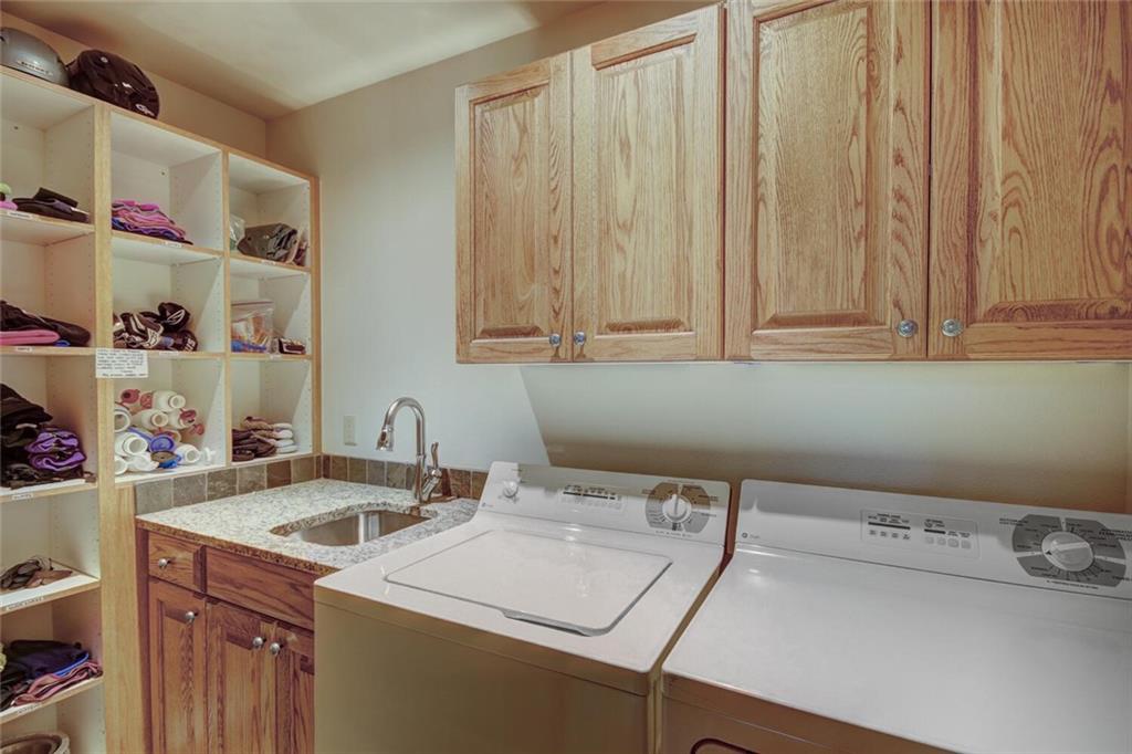 265 Mountain Bluebell Road Keystone, CO 80435 - Photo 17 of 35 a utility room with dryer and washer