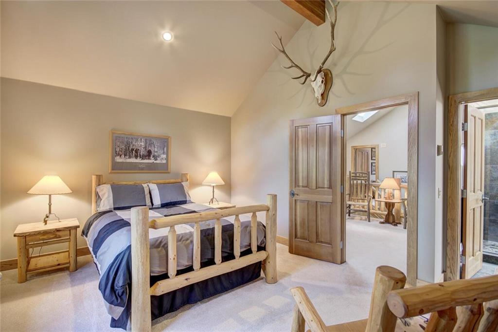 265 Mountain Bluebell Road Keystone, CO 80435 - Photo 20 of 35 a bedroom with a bed a couch and dresser