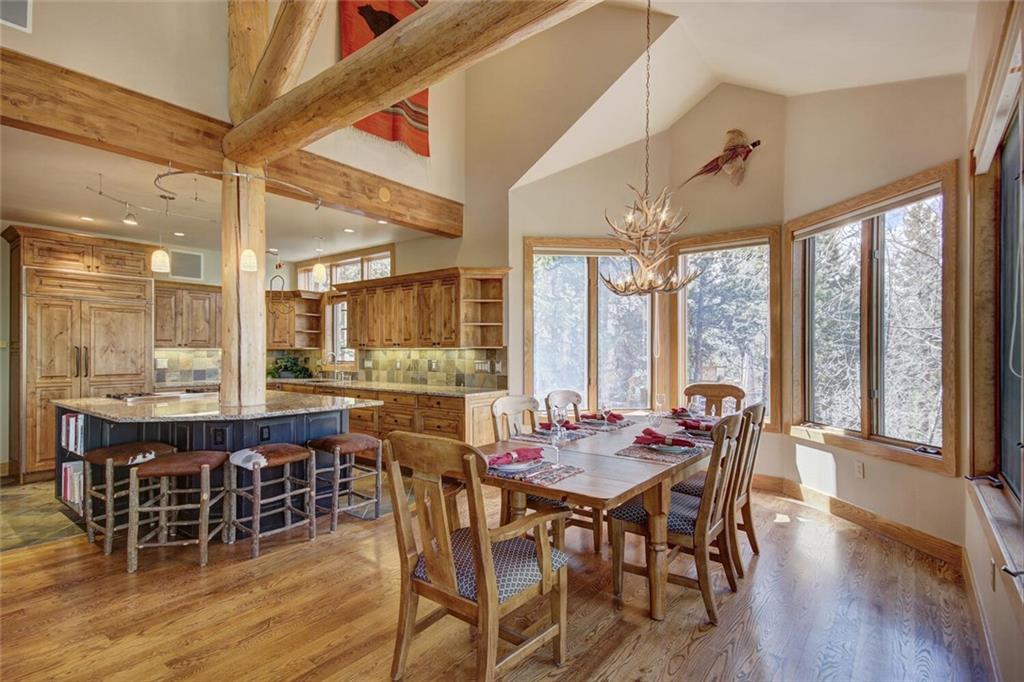 265 Mountain Bluebell Road Keystone, CO 80435 - Photo 3 of 35 a view of a dining room with furniture window and wooden floor