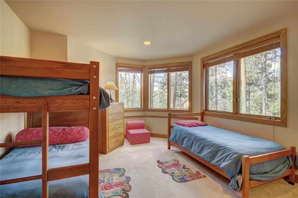 265 Mountain Bluebell Road Keystone, CO 80435 - Photo 26 of 35 a bedroom with a bed and window