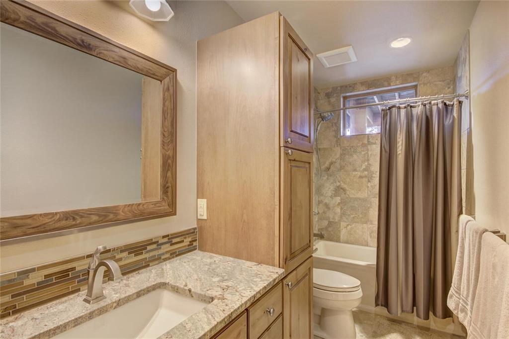 265 Mountain Bluebell Road Keystone, CO 80435 - Photo 27 of 35 a bathroom with a granite countertop sink toilet and shower