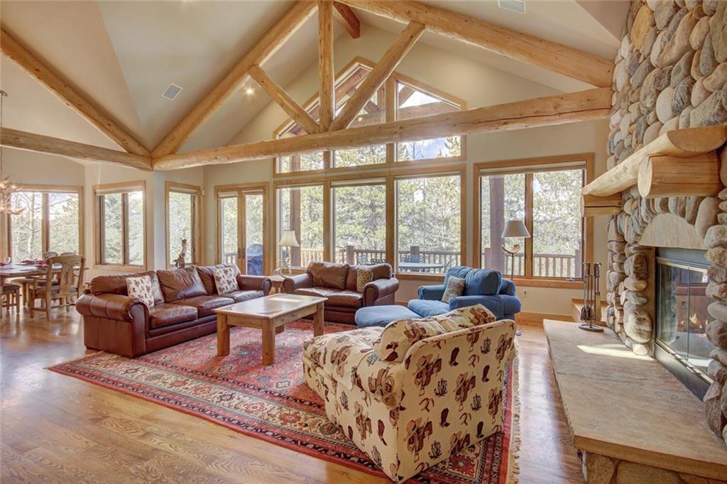 265 Mountain Bluebell Road Keystone, CO 80435 - Photo 34 of 35 a living room with furniture large windows and fireplace