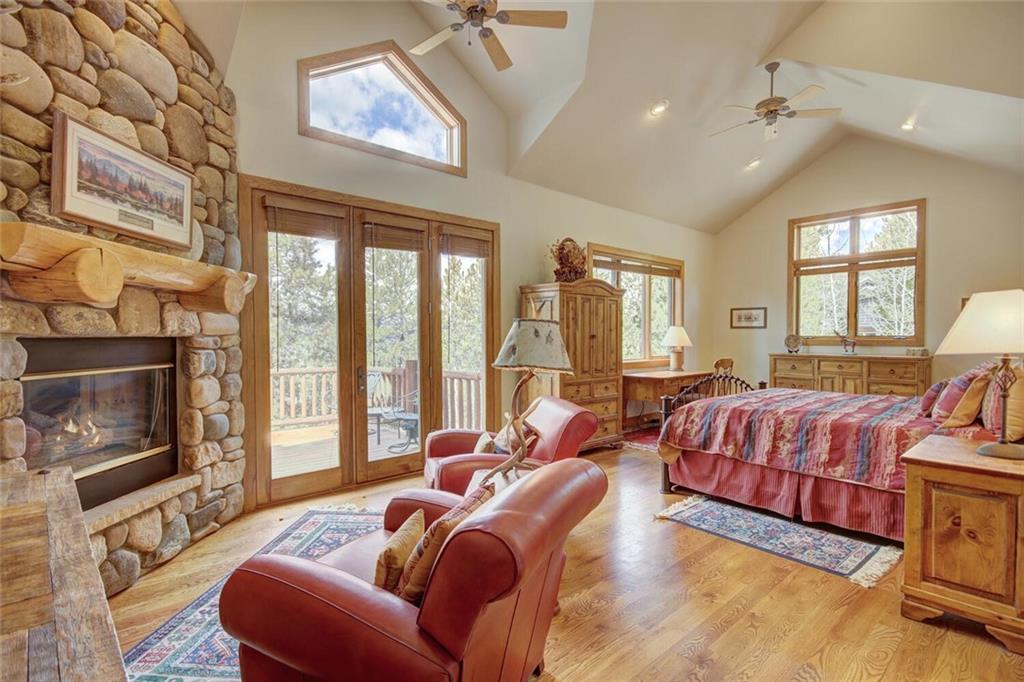 265 Mountain Bluebell Road Keystone, CO 80435 - Photo 5 of 35 a spacious bedroom with a bed and glass windows
