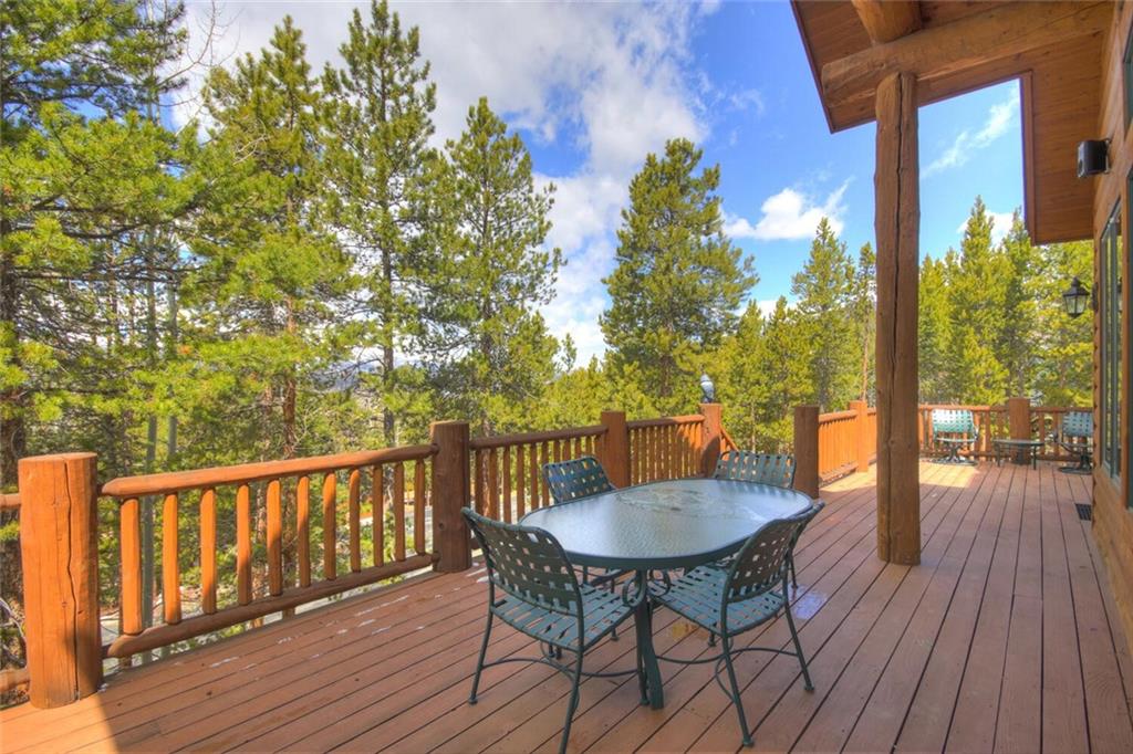 265 Mountain Bluebell Road Keystone, CO 80435 - Photo 9 of 35 a view of a balcony with a table and chairs