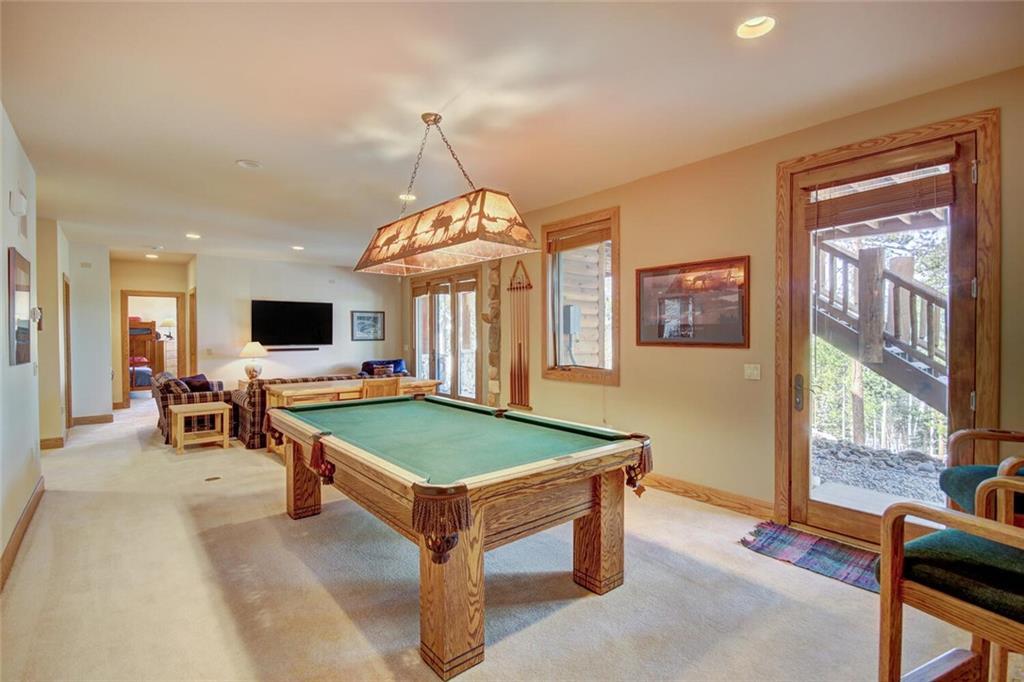265 Mountain Bluebell Road Keystone, CO 80435 - Photo 10 of 35 a room with pool table and windows