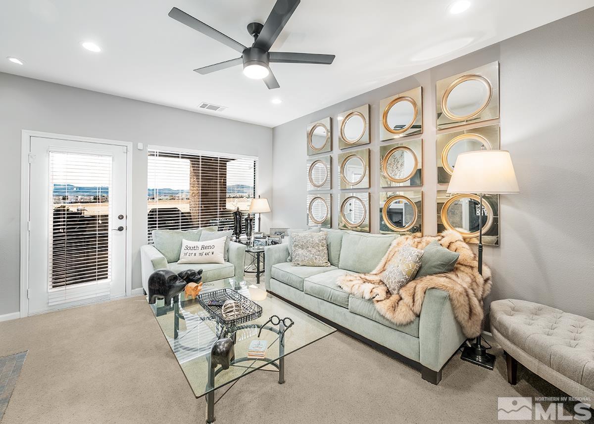 900 South Meadows Parkway, Unit 4123 Reno, NV 89521 - Photo 3 of 19 a living room with furniture and a large window