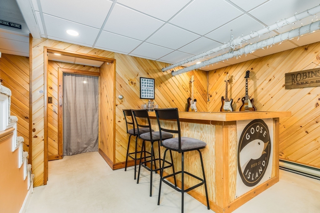 4 Acadia Kimball Road, Unit 4 Amesbury, MA 01913 - Photo 16 of 20 a view of a garage with table and chairs