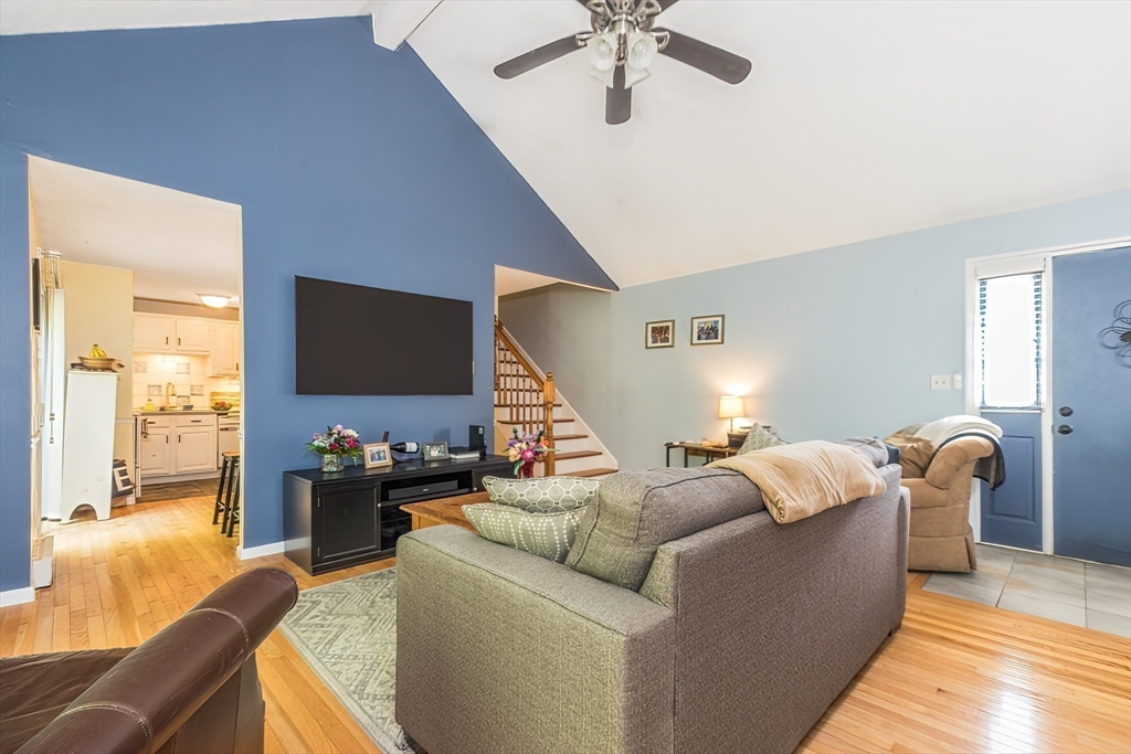 4 Acadia Kimball Road, Unit 4 Amesbury, MA 01913 - Photo 2 of 20 a living room with furniture and a flat screen tv