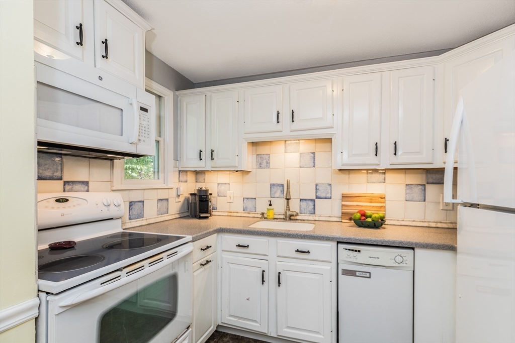 4 Acadia Kimball Road, Unit 4 Amesbury, MA 01913 - Photo 6 of 20 a kitchen with cabinets a sink and appliances