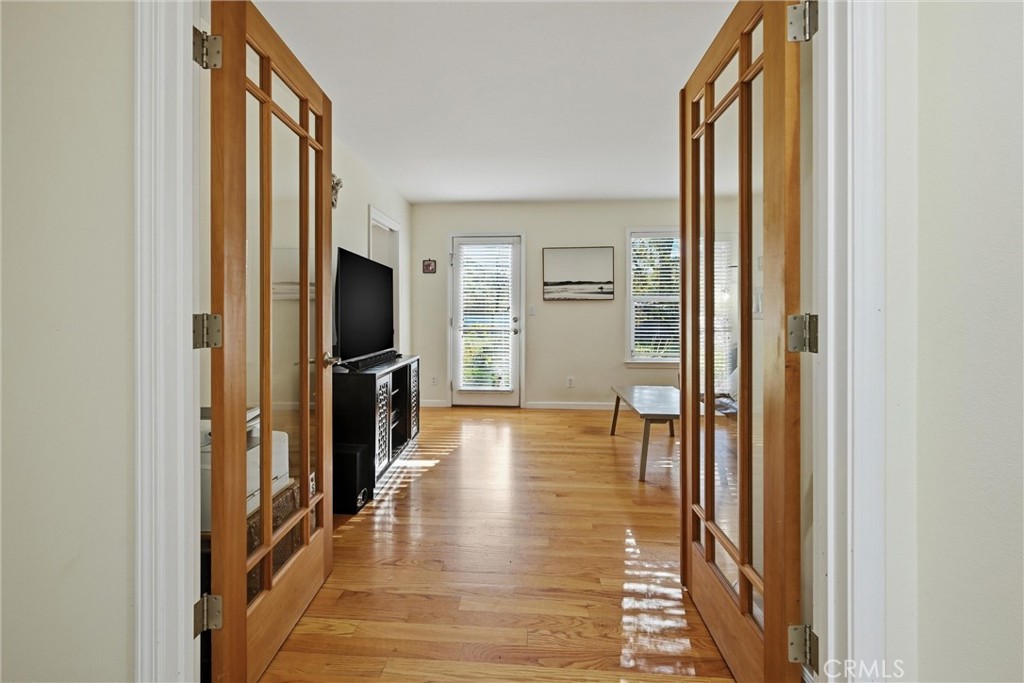 21264 Santa Clara Road Middletown, CA 95461 - Photo 14 of 39 a view of a hallway with wooden floor and a living room