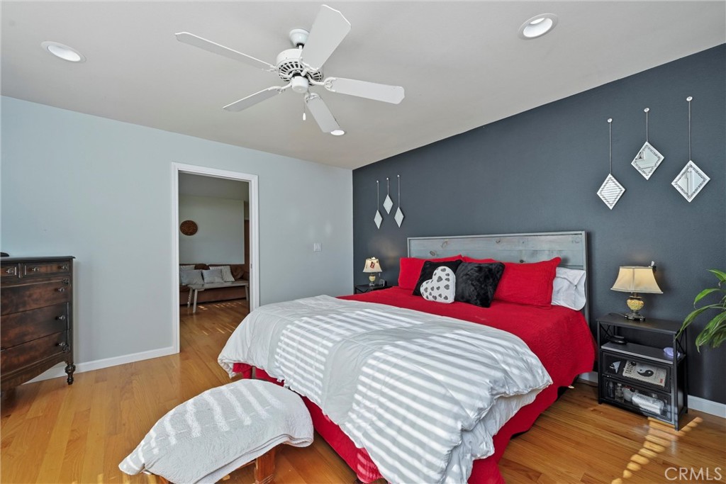 21264 Santa Clara Road Middletown, CA 95461 - Photo 19 of 39 a bedroom with a bed and a chandelier