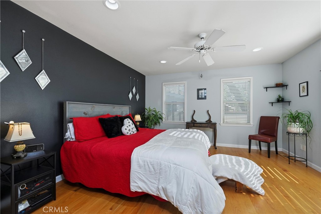 21264 Santa Clara Road Middletown, CA 95461 - Photo 20 of 39 a bedroom with a bed and wooden floor