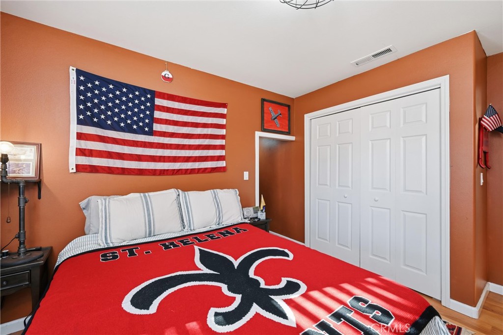 21264 Santa Clara Road Middletown, CA 95461 - Photo 32 of 39 a bedroom with a bed and a painting on the wall