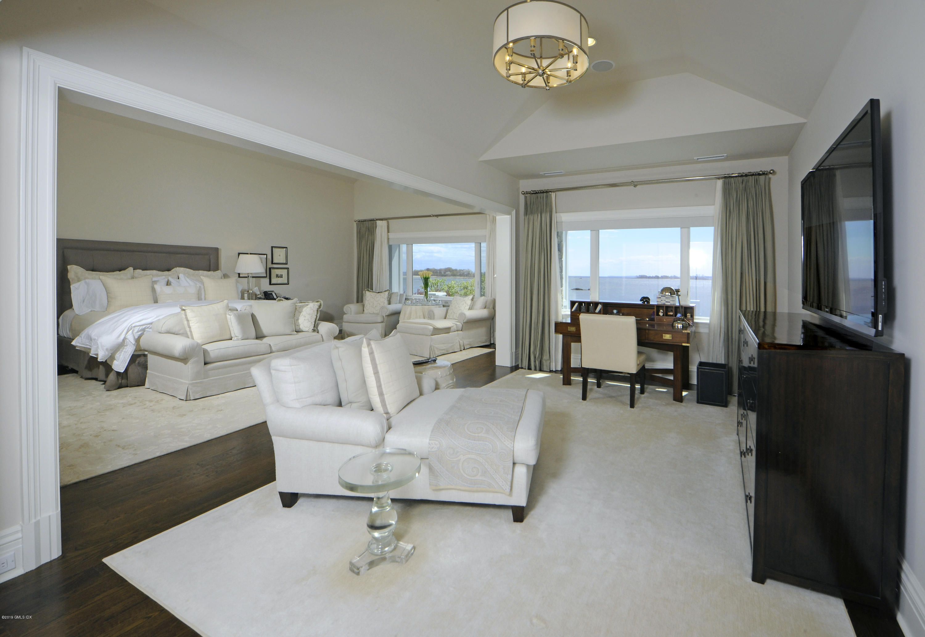 215 Byram Shore Road Greenwich, CT 06830 - Photo 14 of 26 a living room with furniture and a flat screen tv