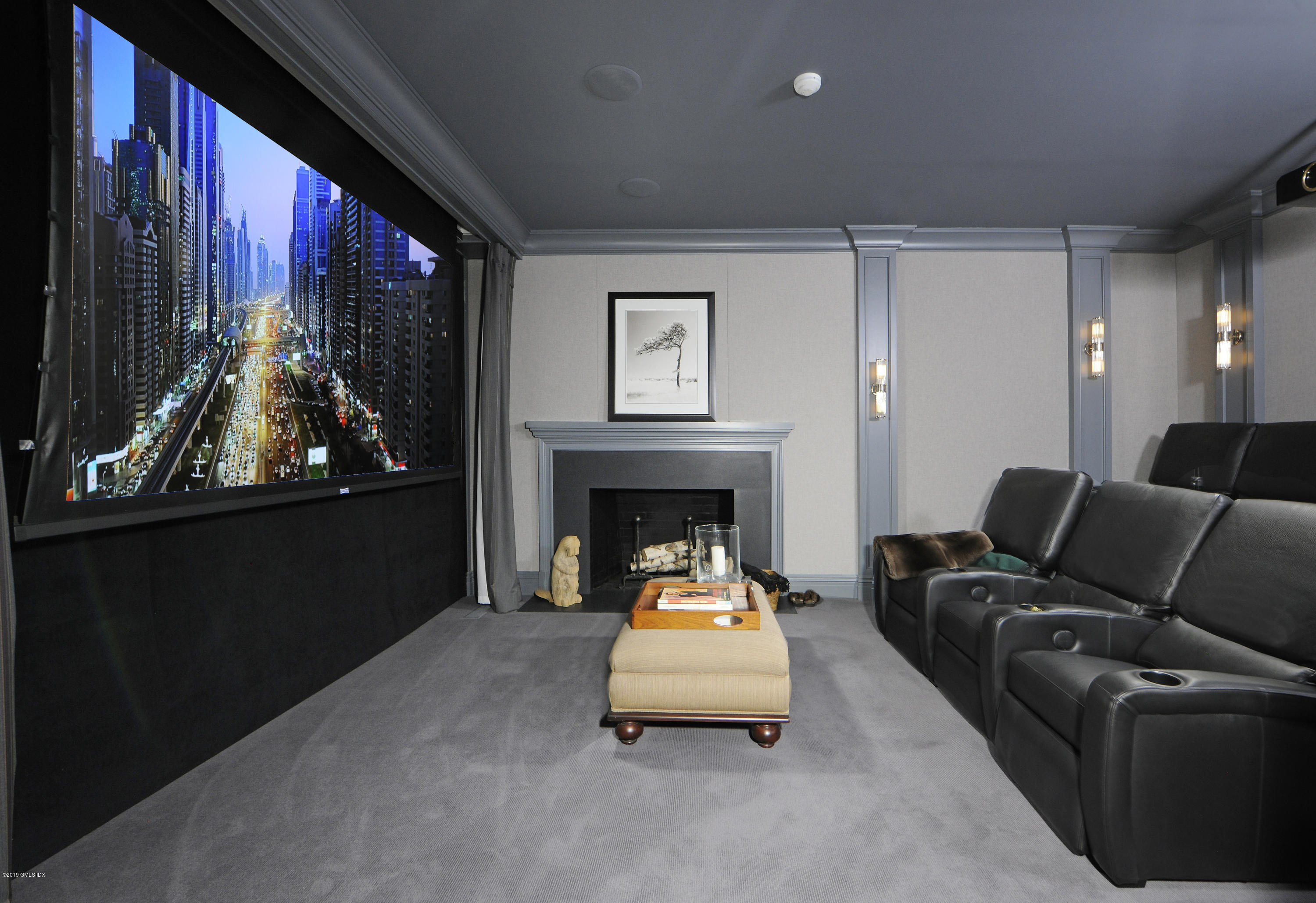 215 Byram Shore Road Greenwich, CT 06830 - Photo 18 of 26 a living room with furniture and a fireplace