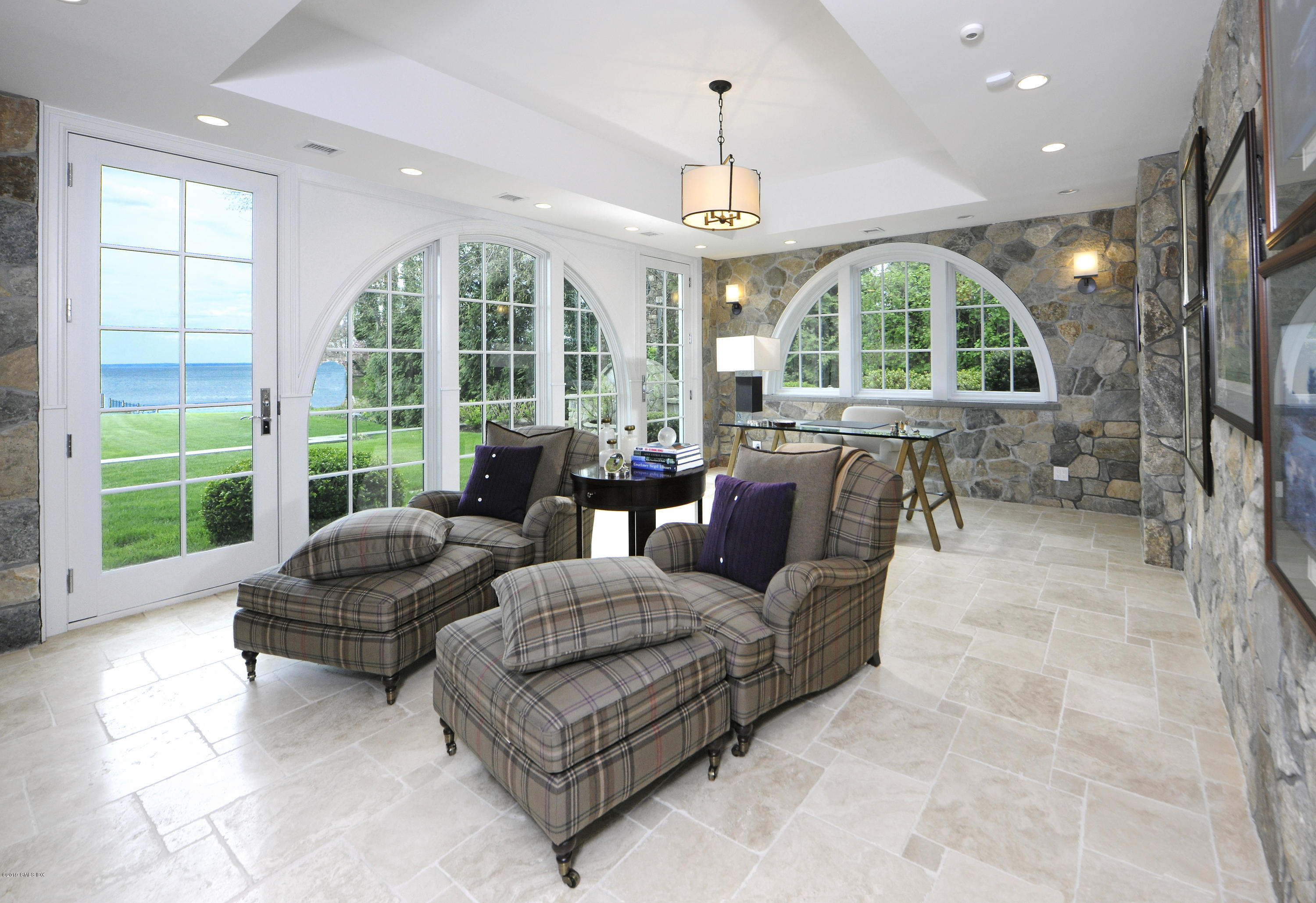 215 Byram Shore Road Greenwich, CT 06830 - Photo 19 of 26 a living room with furniture and a large window